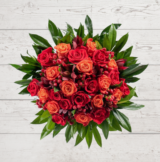 Harvest Dreams product with a large arrangement of red and orange roses displayed