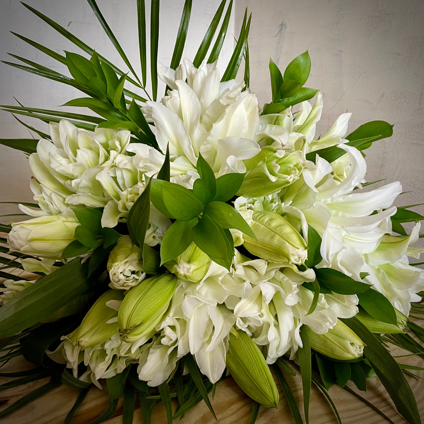 "Make My Day" white flowers displayed on a wooden table