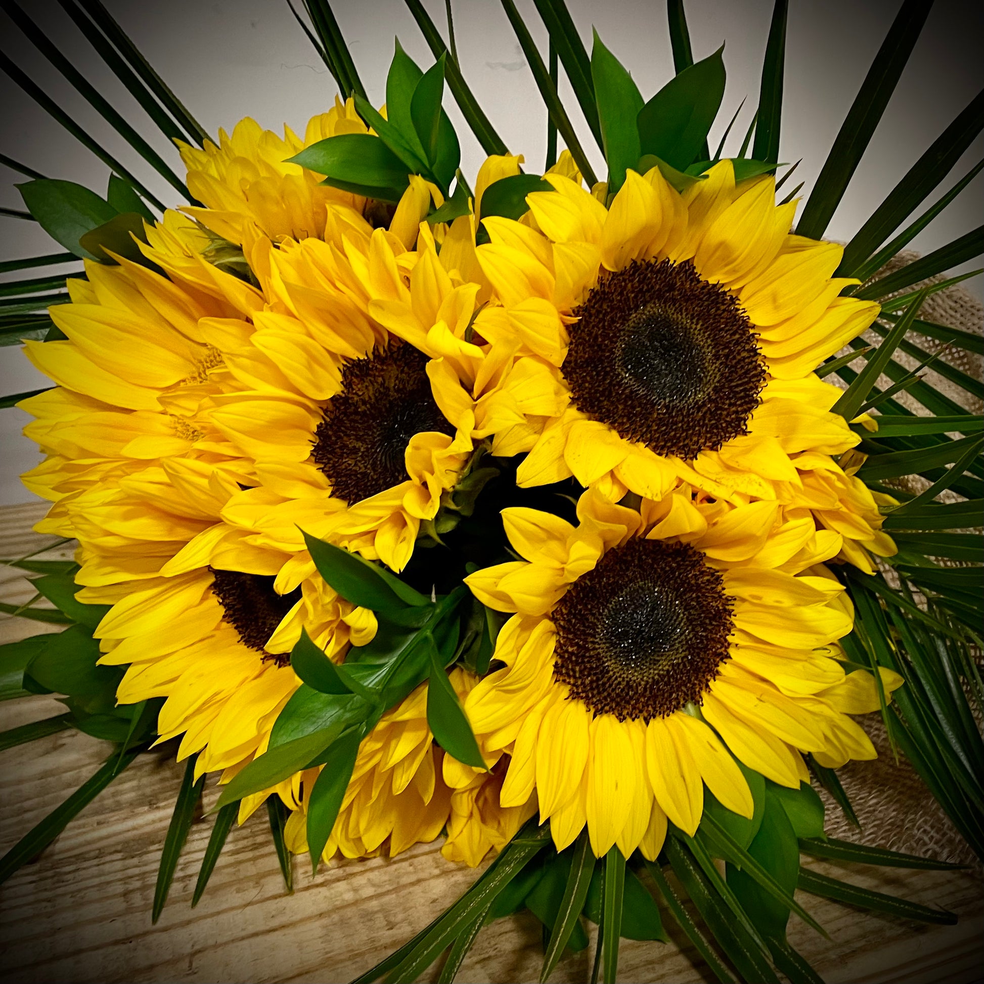 Close-up view of the 'Sunny Day' product displaying a group of sunflowers